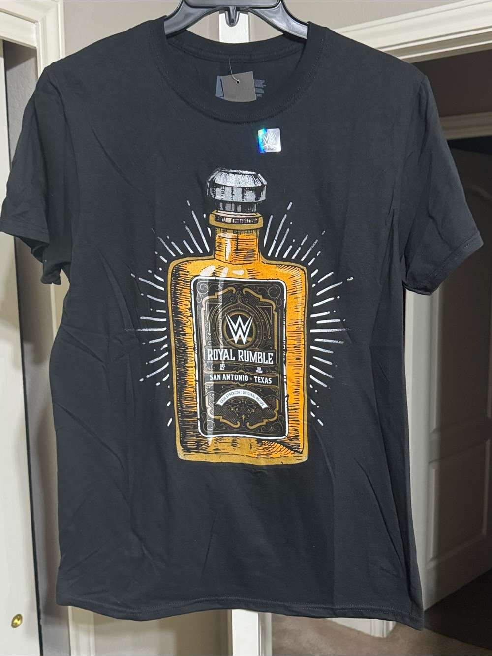 WWE Black Short-Sleeve Tee with Gold Bottle Graphic